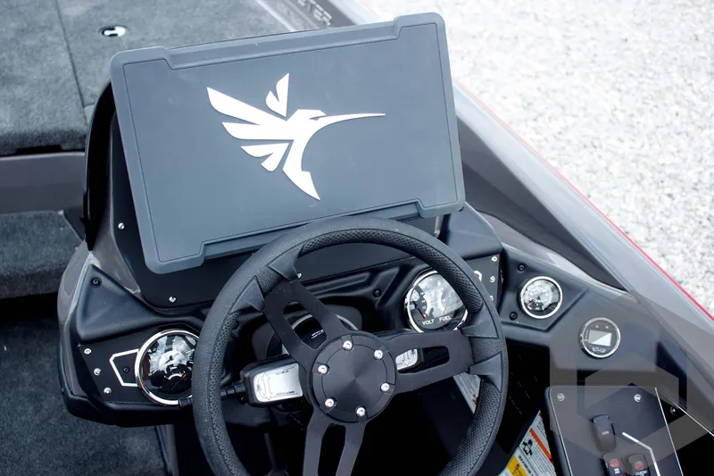 Slide: The Image of Steering console of 2025 Skeeter ZXR 21 boat with modern dashboard design. - 33