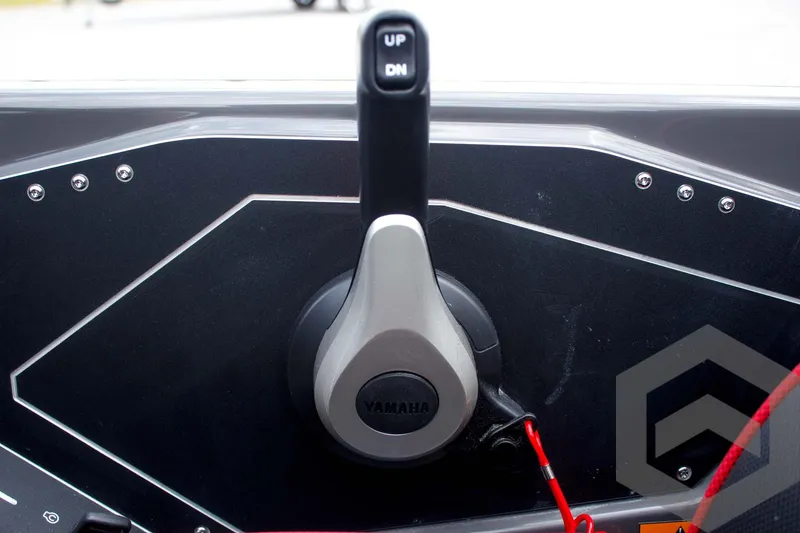 Slide: The Image of Throttle control lever on 2025 Skeeter ZXR 21 boat dashboard, featuring Yamaha branding. - 35