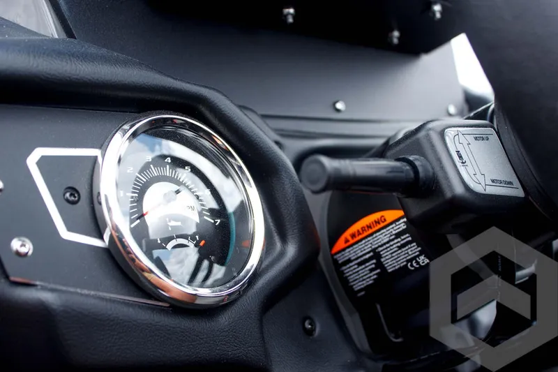 Slide: The Image of Dashboard of 2025 Skeeter ZXR 21 with gauge and control lever. - 36