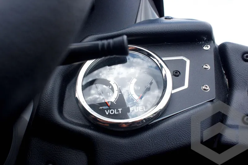 Slide: The Image of Dashboard of 2025 Skeeter ZXR 21 showing volt and fuel gauges. - 37