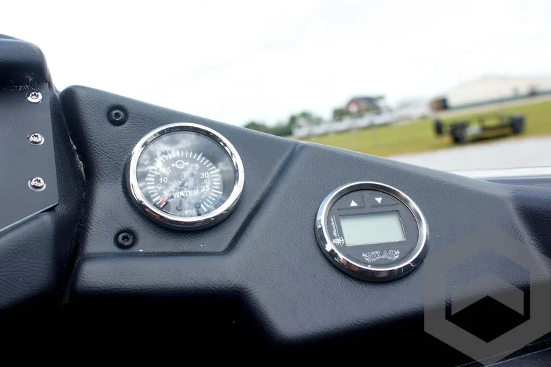 Slide: The Image of Dashboard of 2025 Skeeter ZXR 21 boat with gauges and digital display. - 38