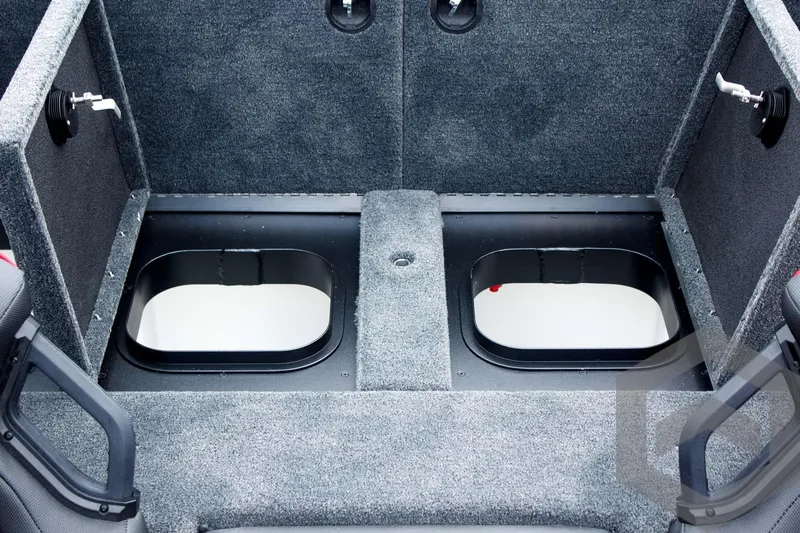 Slide: The Image of Interior of 2025 Skeeter ZXR 21 boat showing storage compartments and carpeted flooring. - 40