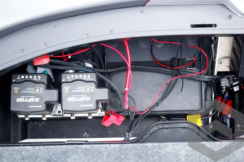 Slide: The Image of Battery compartment of 2025 Skeeter ZXR 21 with wiring and dual power units. - 44