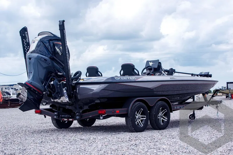 Slide: The Image of 2025 Skeeter ZXR 21 boat on trailer, featuring sleek design and powerful engine. - 5
