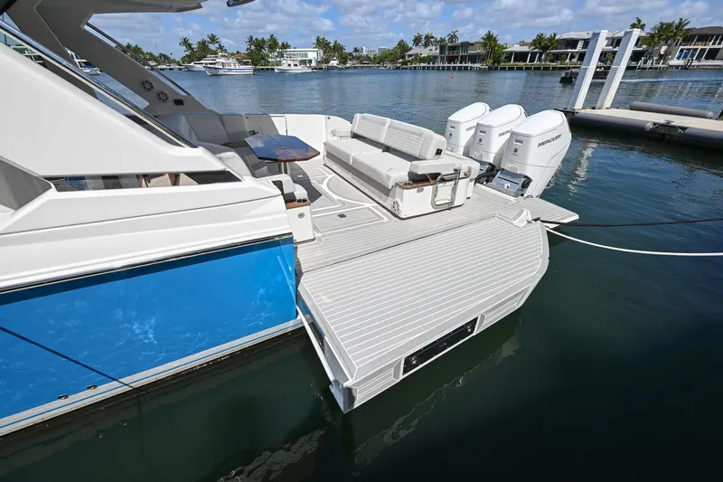 Slide: The Image of 2023 Tiara Yachts 48 LS luxury boat with spacious deck and powerful engines. - 10