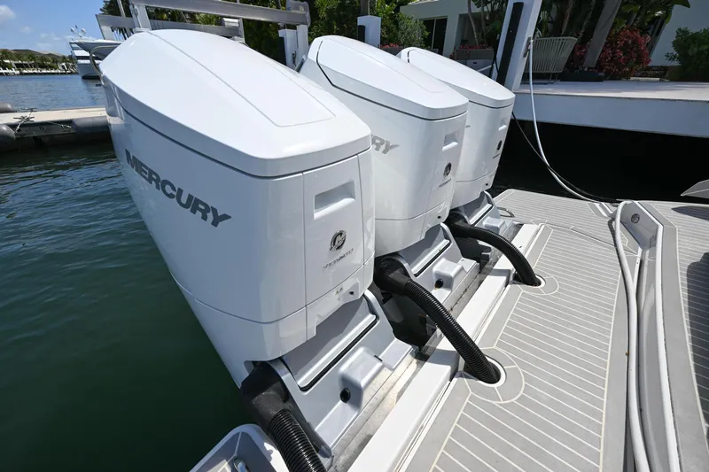 Slide: The Image of 2023 Tiara Yachts 48 LS with dual Mercury outboard engines docked. - 13