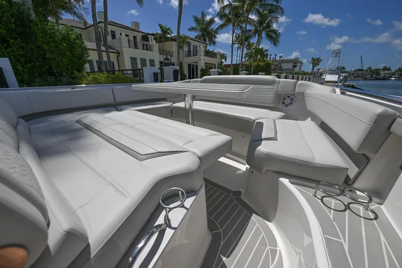 Slide: The Image of 2023 Tiara Yachts 48 LS luxury seating area with elegant design and waterfront view. - 19
