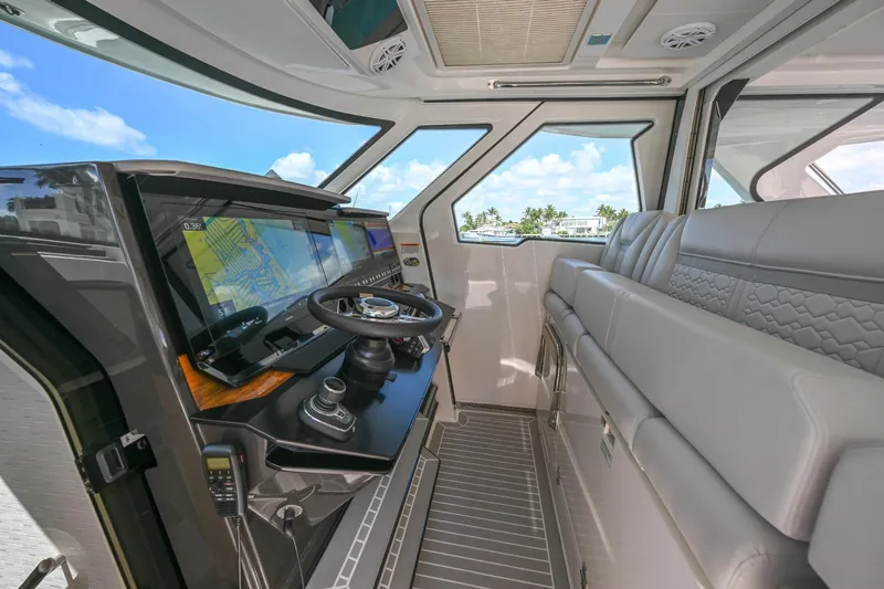 Slide: The Image of 2023 Tiara Yachts 48 LS interior with modern helm and luxurious seating. - 29