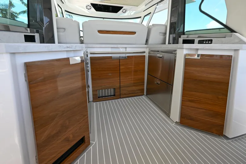 Slide: The Image of 2023 Tiara Yachts 48 LS interior with sleek wood cabinetry and modern design. - 39