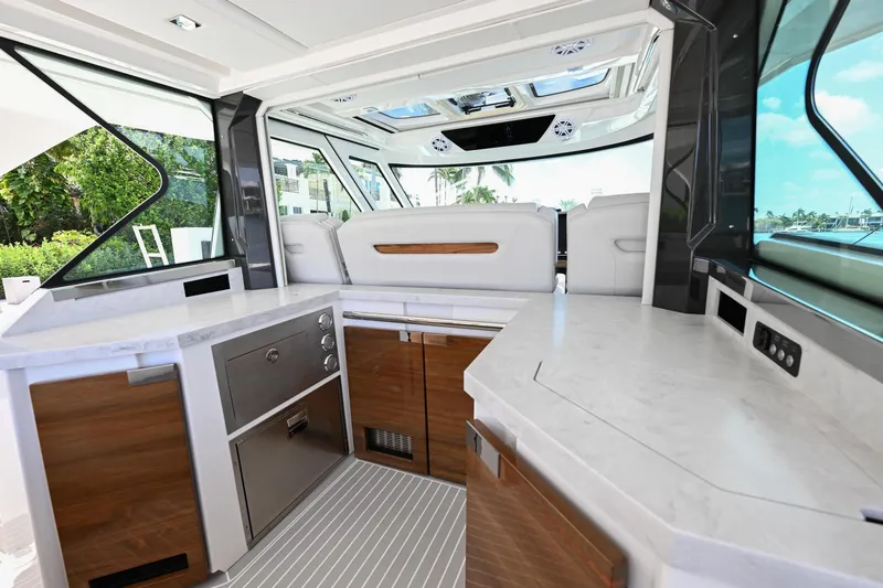 Slide: The Image of Luxurious interior of 2023 Tiara Yachts 48 LS, featuring modern kitchen and seating area. - 41