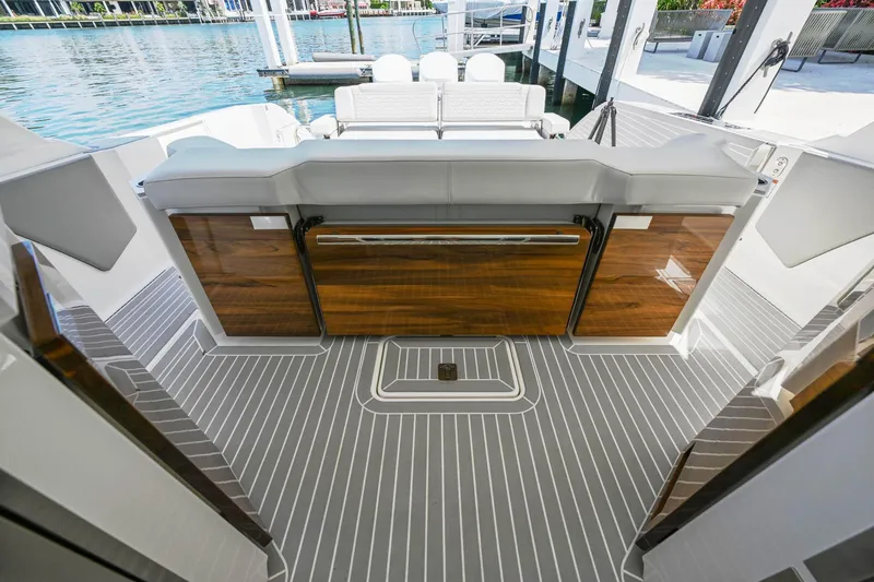 Slide: The Image of 2023 Tiara Yachts 48 LS luxury yacht interior with sleek wood and modern design. - 42