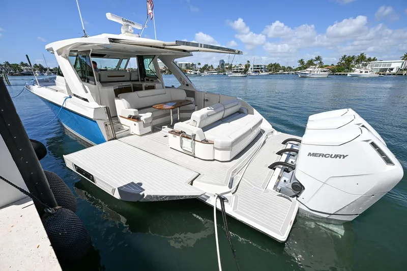 Slide: The Image of 2023 Tiara Yachts 48 LS luxury boat with spacious deck and powerful Mercury engines. - 9