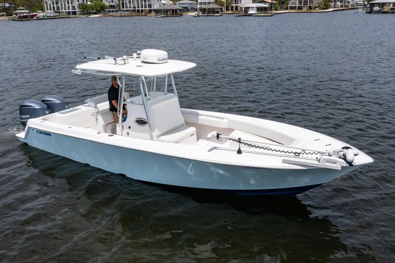 Slide: The Image of 2014 Contender 30st boat on water, featuring dual engines and a center console. - 0