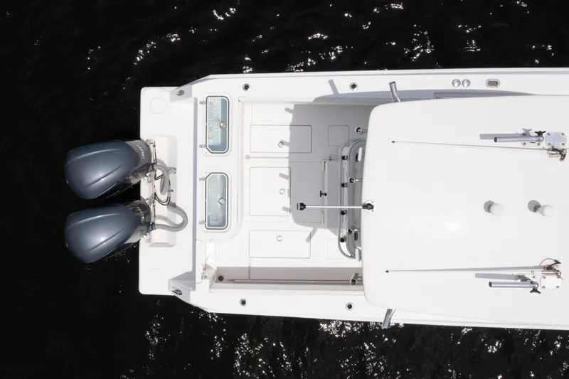 Slide: The Image of Overhead view of 2014 Contender 30st boat with dual outboard motors. - 13