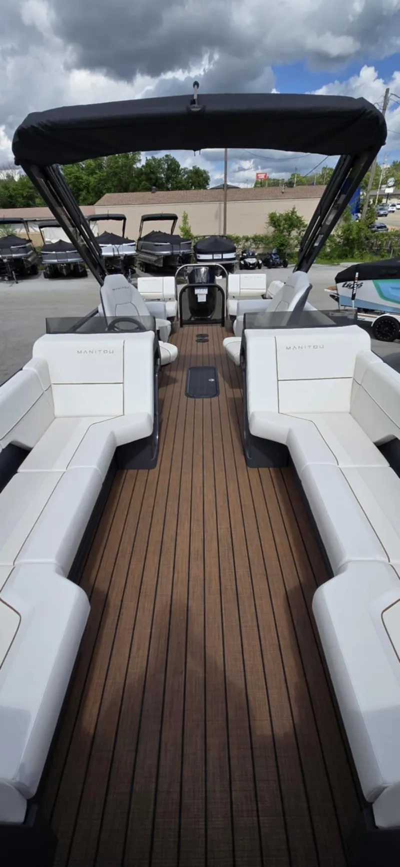 Slide: The Image of 2025 Manitou Explore boat with sleek design, spacious seating, and modern features. - 12