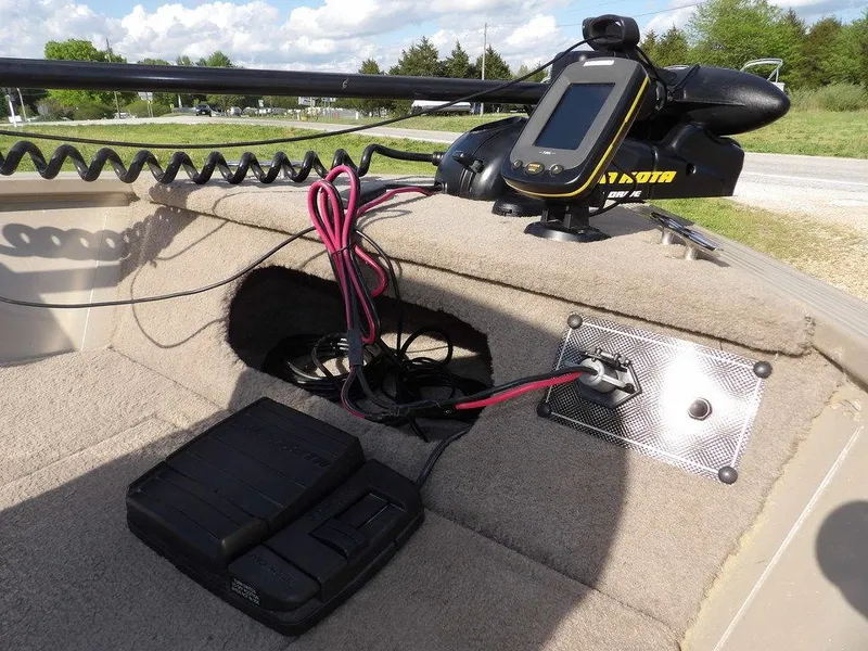 Slide: The Image of 2006 Lowe FM165SC boat with electronic equipment and wiring on deck. - 12