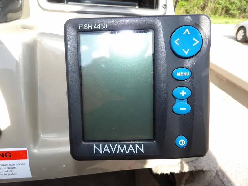 Slide: The Image of Navman Fish 4430 fishfinder on a 2006 Lowe FM165SC boat dashboard. - 19