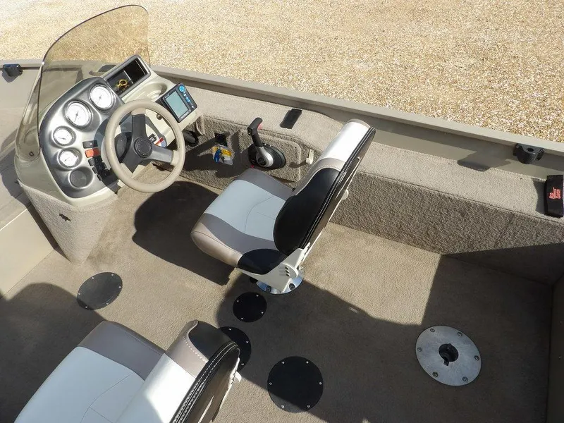Slide: The Image of 2006 Lowe FM165SC boat interior with steering console and seating. - 22