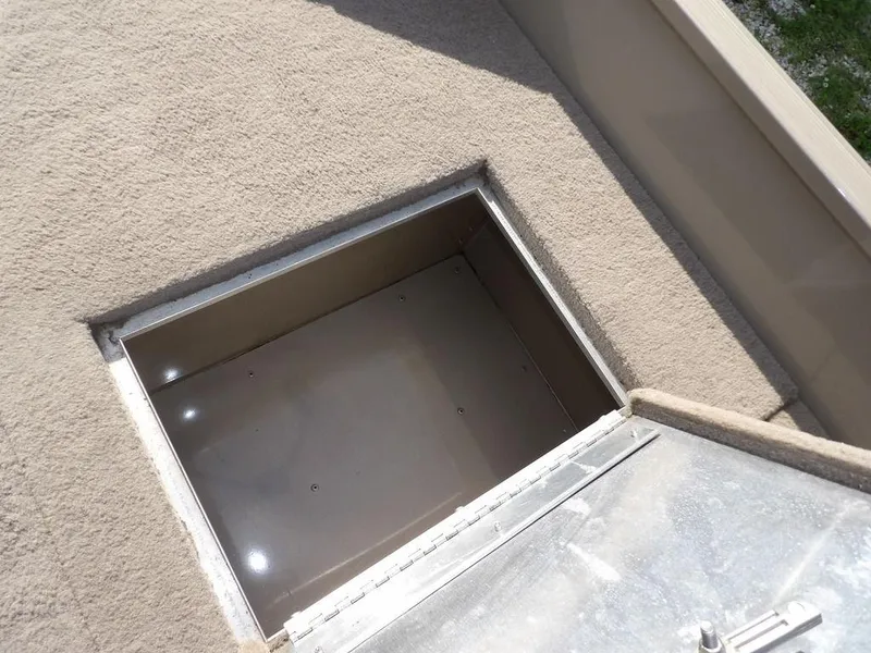 Slide: The Image of Basement egress window with open metal cover, Lowe FM165SC, 2006 model. - 29