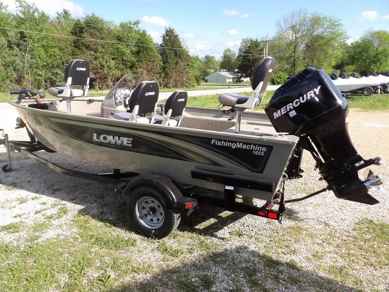Slide: The Image of 2006 Lowe FM165SC fishing boat with Mercury outboard motor on trailer. - 33