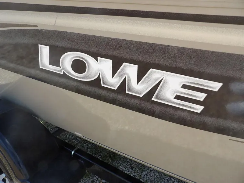 Slide: The Image of 2006 Lowe FM165SC boat logo on side panel. - 4