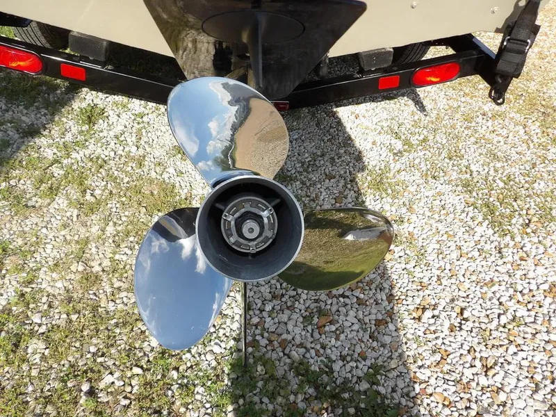Slide: The Image of Propeller of a 2006 Lowe FM165SC boat on gravel surface. - 7
