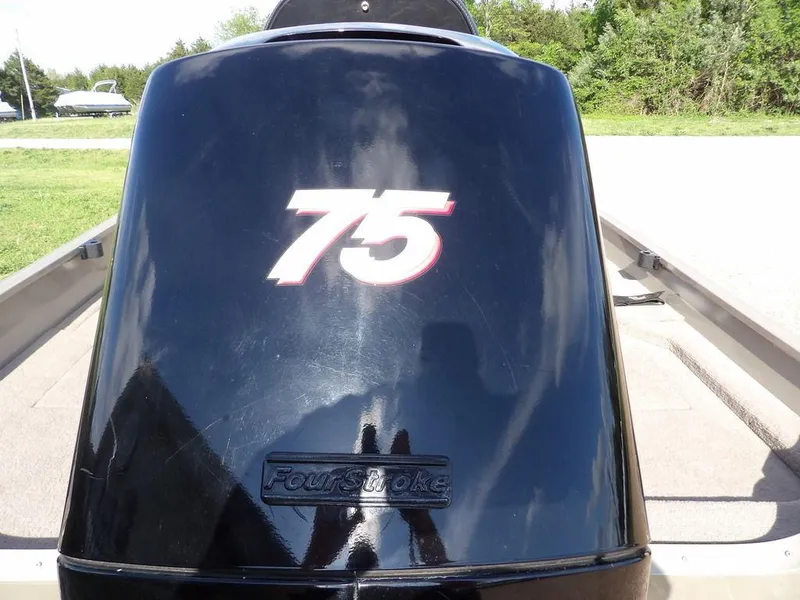 Slide: The Image of Outboard motor with "75" label on a 2006 Lowe FM165SC boat. - 8