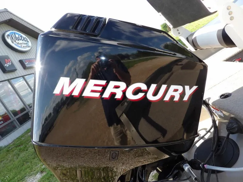 Slide: The Image of Mercury outboard motor on 2006 Lowe FM165SC boat, reflecting surroundings. - 9