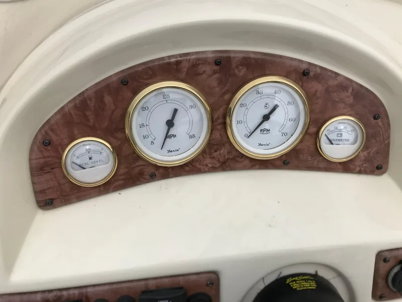 Slide: The Image of Dashboard of a 2005 Bentley Pontoons 243 with speedometer and RPM gauges. - 22