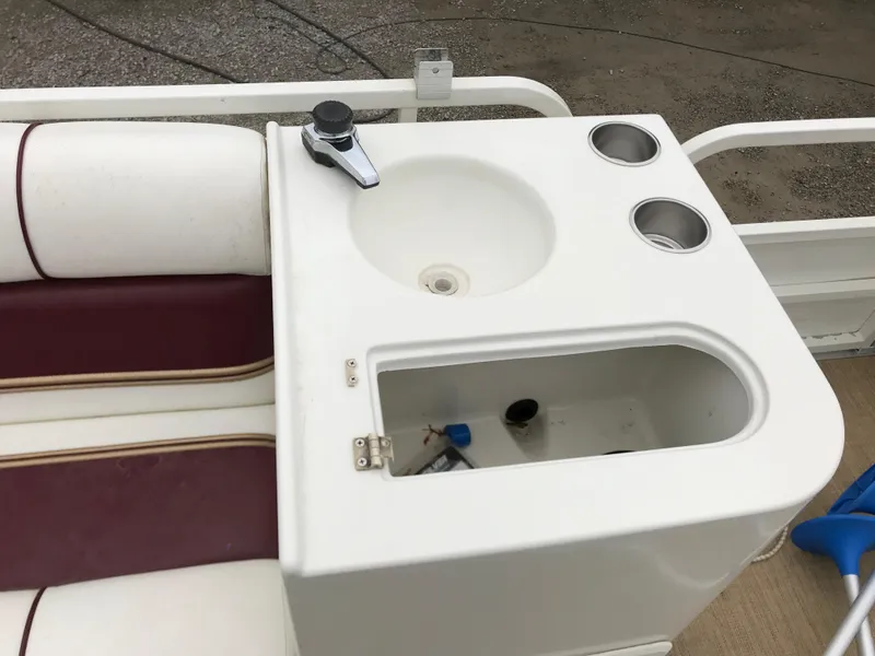 Slide: The Image of 2005 Bentley Pontoons 243 boat sink with faucet and cup holders. - 8