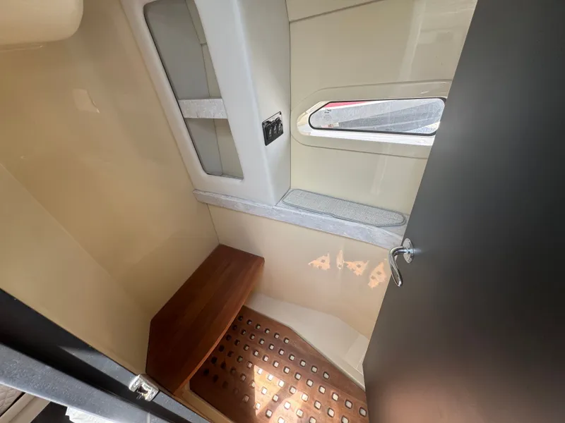Slide: The Image of Interior of a Regal 38 XO with wooden flooring and a window. - 15