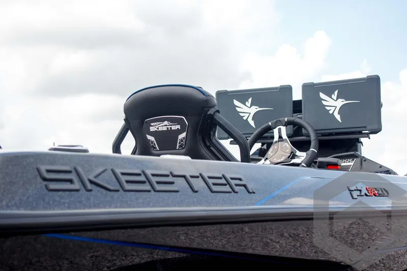 Slide: The Image of 2025 Skeeter FXR 21 Limited boat with advanced dashboard and sleek design. - 15