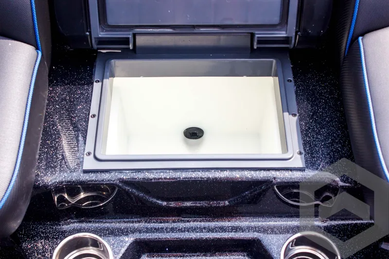 Slide: The Image of 2025 Skeeter FXR 21 Limited livewell with open lid, showcasing interior design. - 39