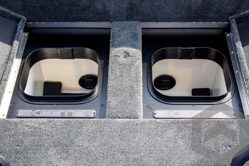Slide: The Image of 2025 Skeeter FXR 21 Limited boat storage compartments with Skeeter branding. - 42