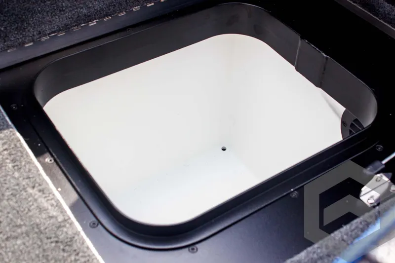 Slide: The Image of 2025 Skeeter FXR 21 Limited boat storage compartment, open and empty. - 43