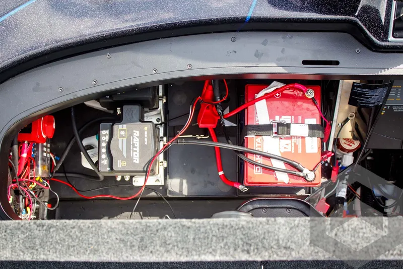 Slide: The Image of 2025 Skeeter FXR 21 Limited boat battery compartment with wiring and components. - 46