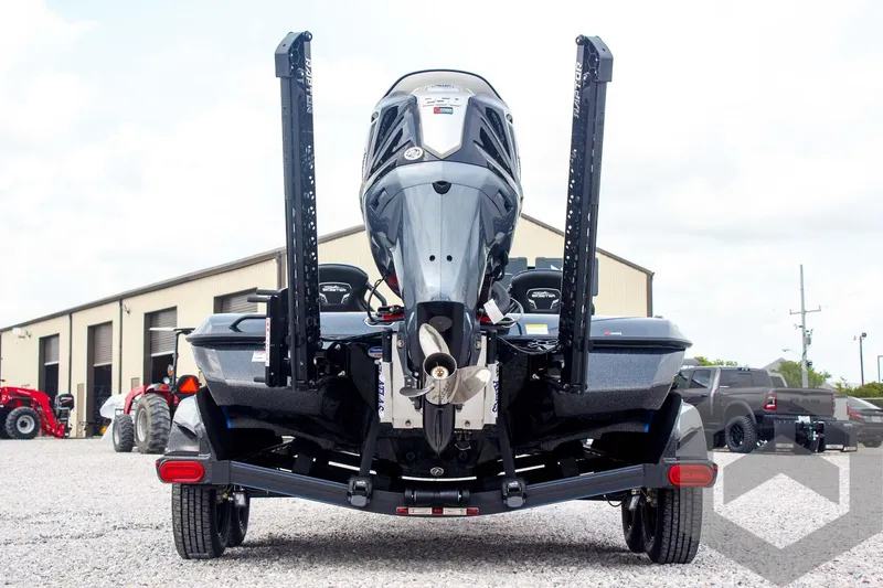Slide: The Image of 2025 Skeeter FXR 21 Limited boat, rear view, parked outdoors. - 6