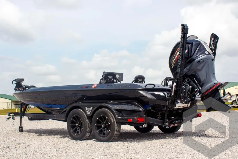 Slide: The Image of 2025 Skeeter FXR 21 Limited boat on trailer, featuring sleek design and powerful engine. - 7