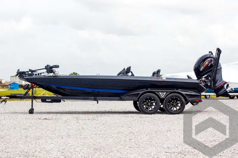 Slide: The Image of 2025 Skeeter FXR 21 Limited boat on trailer, side view, outdoors. - 8