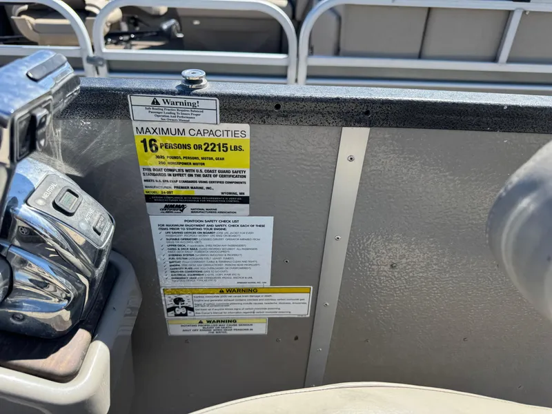 Slide: The Image of 2014 Premier 251 Cast-A-Way boat capacity label, maximum 16 persons or 2215 lbs. - 15