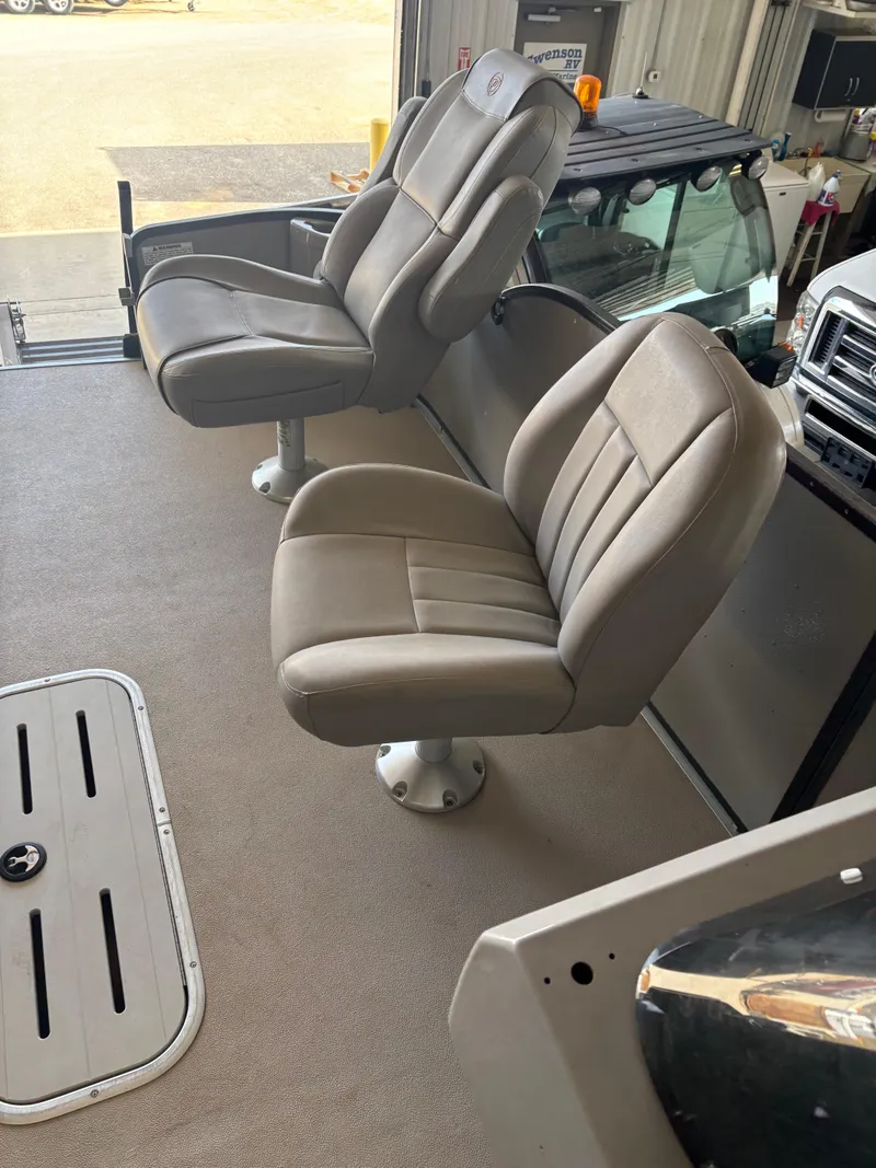 Slide: The Image of 2014 Premier 251 Cast-A-Way boat interior with two cushioned seats. - 25