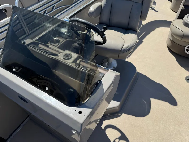 Slide: The Image of 2014 Premier 251 Cast-A-Way boat interior with steering console and seating. - 8