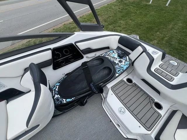 Slide: The Image of 2019 Yamaha AR195 boat interior with wakeboard storage and seating area. - 12