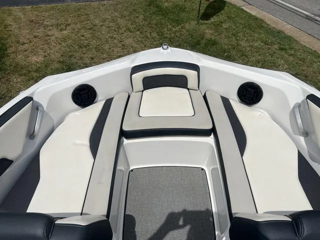 Slide: The Image of 2019 Yamaha AR195 boat interior with cushioned seating and speakers. - 15