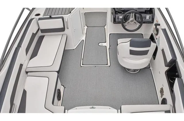 Slide: The Image of 2019 Yamaha Boats AR195 interior with gray seating and steering console. - 4