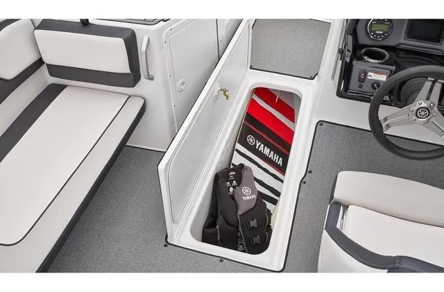 Slide: The Image of 2019 Yamaha AR195 boat interior with storage compartment and life jackets. - 5