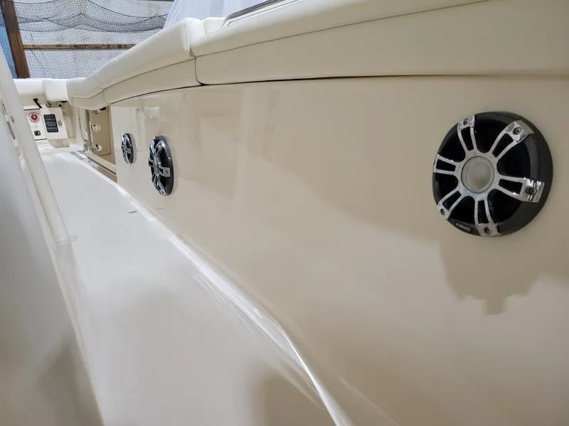 Slide: The Image of 2019 Grady-White 336 Canyon boat with sleek design and built-in speakers. - 11