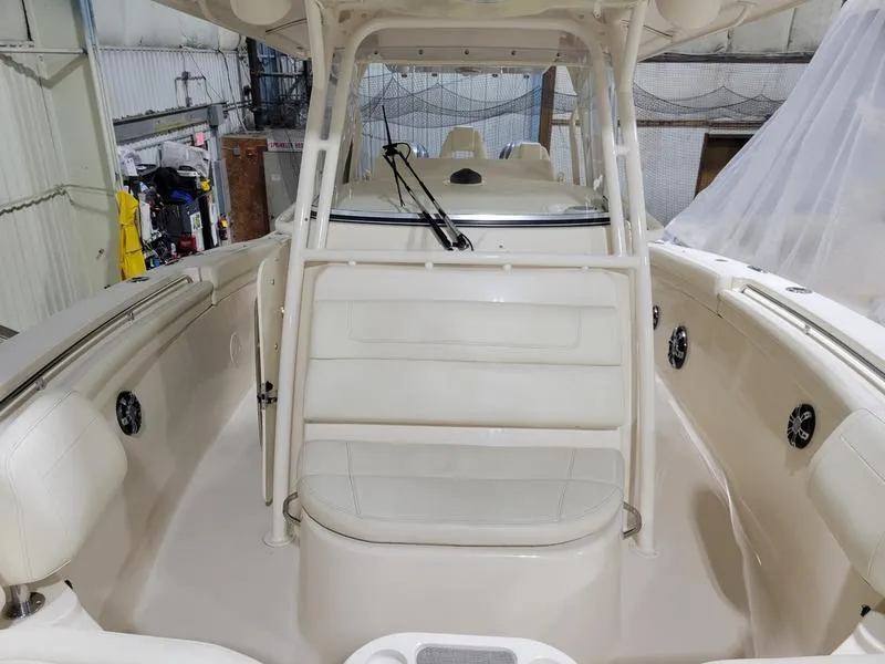 Slide: The Image of 2019 Grady-White 336 Canyon boat interior with seating and helm station. - 15