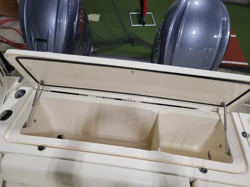 Slide: The Image of Open storage compartment on 2019 Grady-White 336 Canyon boat with dual engines. - 31
