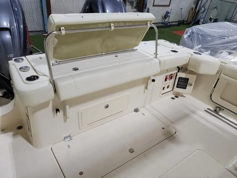 Slide: The Image of 2019 Grady-White 336 Canyon boat interior with seating and storage compartments. - 33